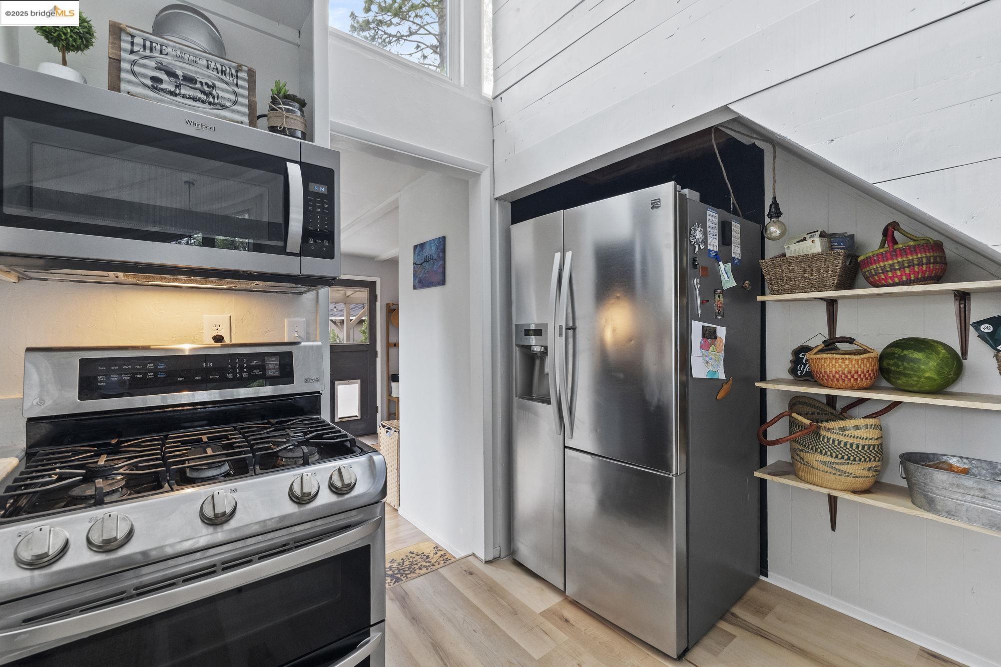 20638 Maranatha Road Tuolumne, CA 95379 - Photo 29 of 60 a kitchen with stainless steel appliances granite countertop a refrigerator and a stove