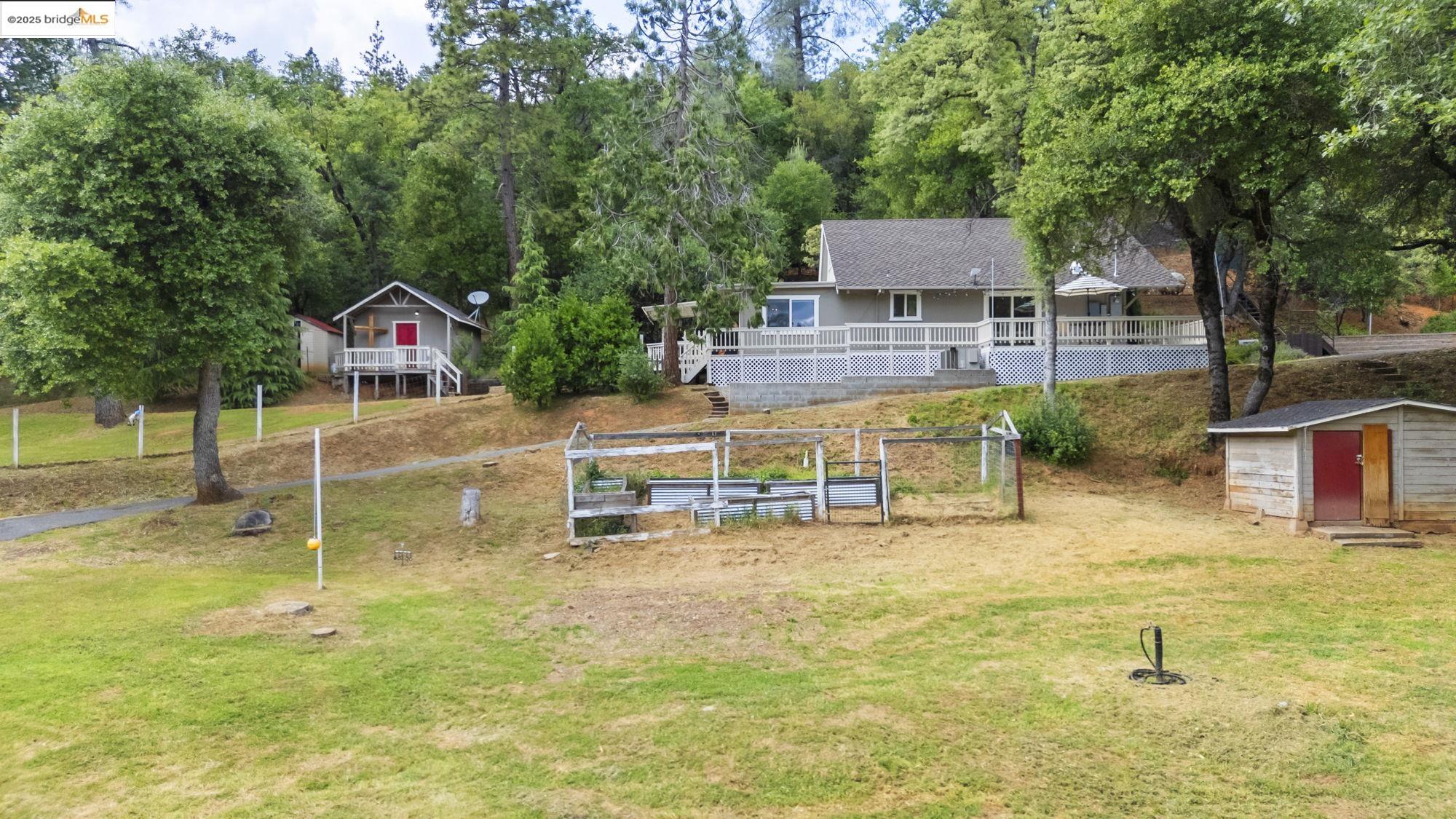 20638 Maranatha Road Tuolumne, CA 95379 - Photo 39 of 60 a view of a house with a yard