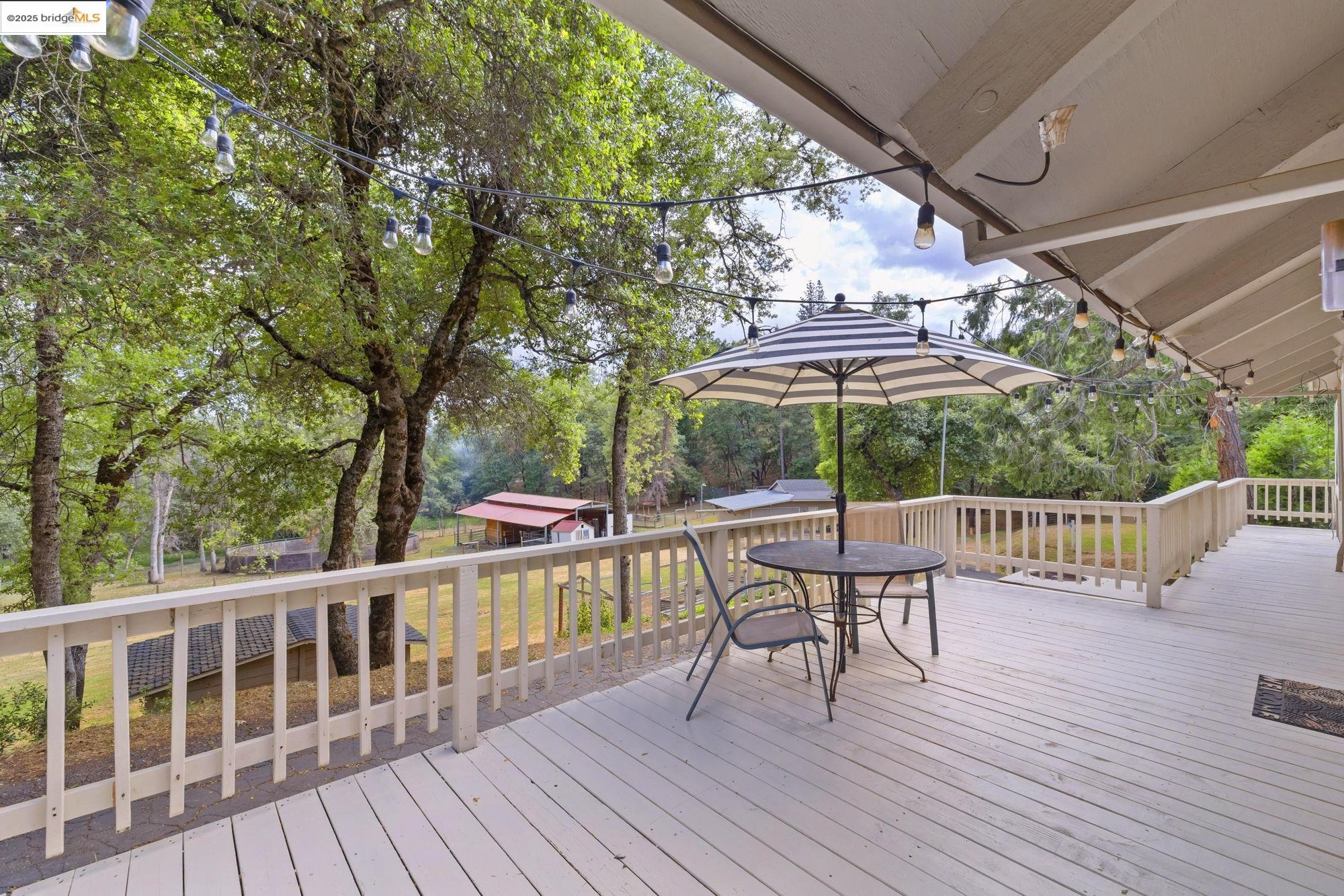 20638 Maranatha Road Tuolumne, CA 95379 - Photo 50 of 60 a view of a chair and table on the wooden floor