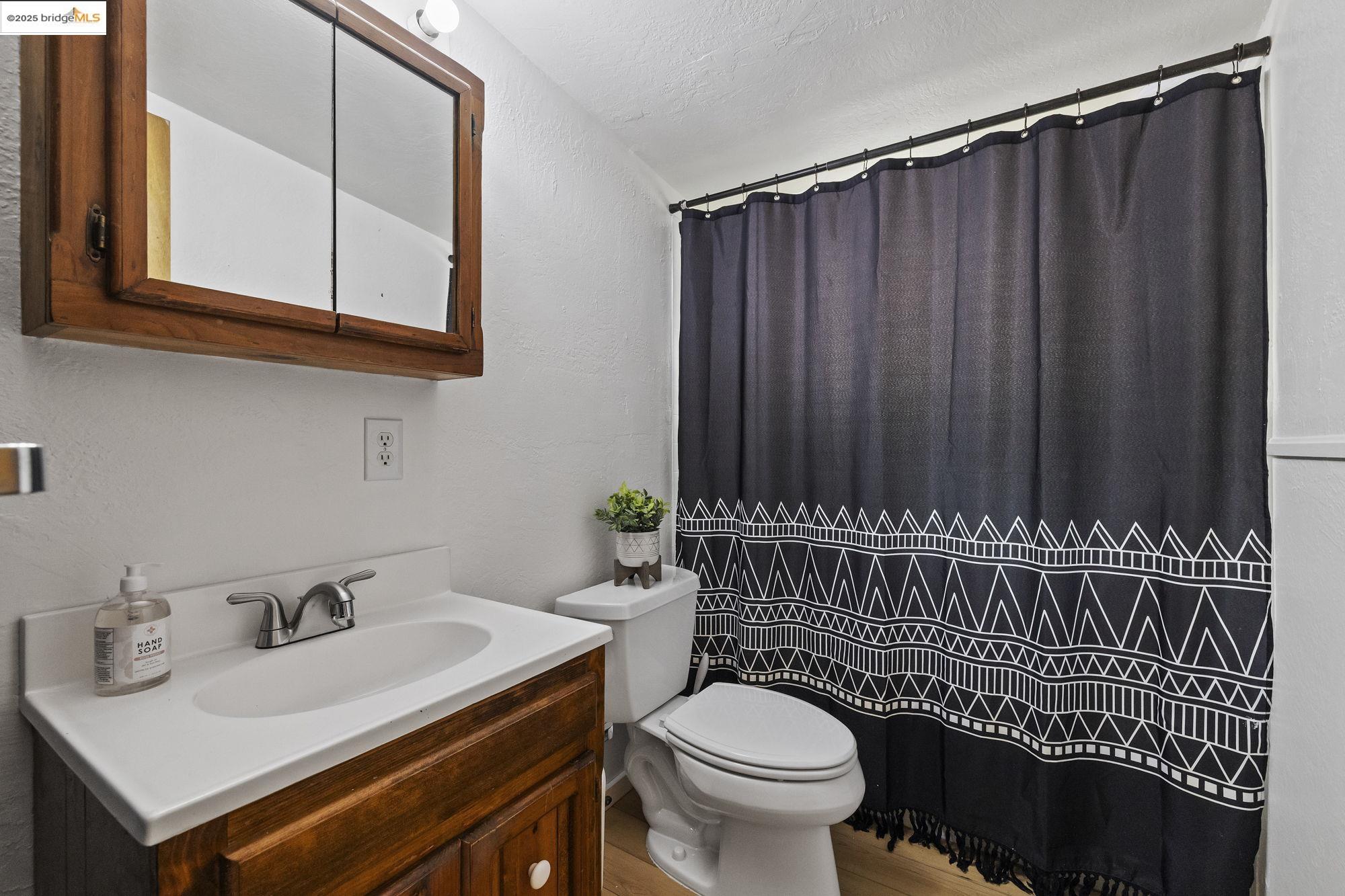 20638 Maranatha Road Tuolumne, CA 95379 - Photo 54 of 60 a bathroom with a sink a toilet and mirror
