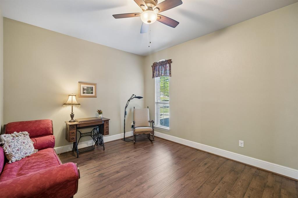 8104 Red Riv Run North Richland Hills, TX 76180 - Photo 19 of 38 a livingroom with furniture and wooden floor