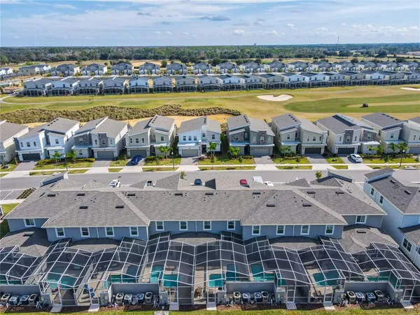 a bedroom with a large bed and a large window
