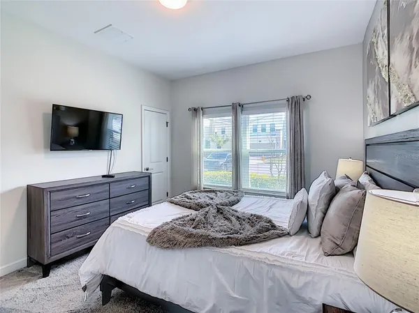 a kitchen with sink refrigerator and microwave