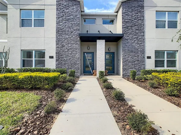 a view of balcony with furniture