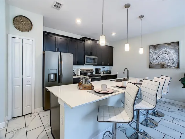 a swimming pool with outdoor seating and yard