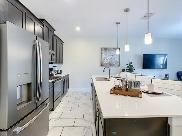 a view of a lake with houses in the back