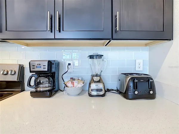a view of a swimming pool with a lounge chairs