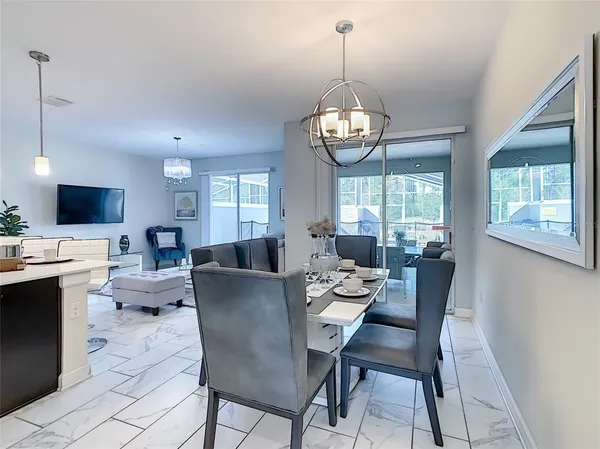a room with lots of furniture and air hockey table