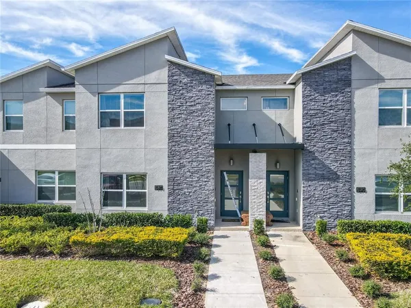 a view of a city with an ocean view