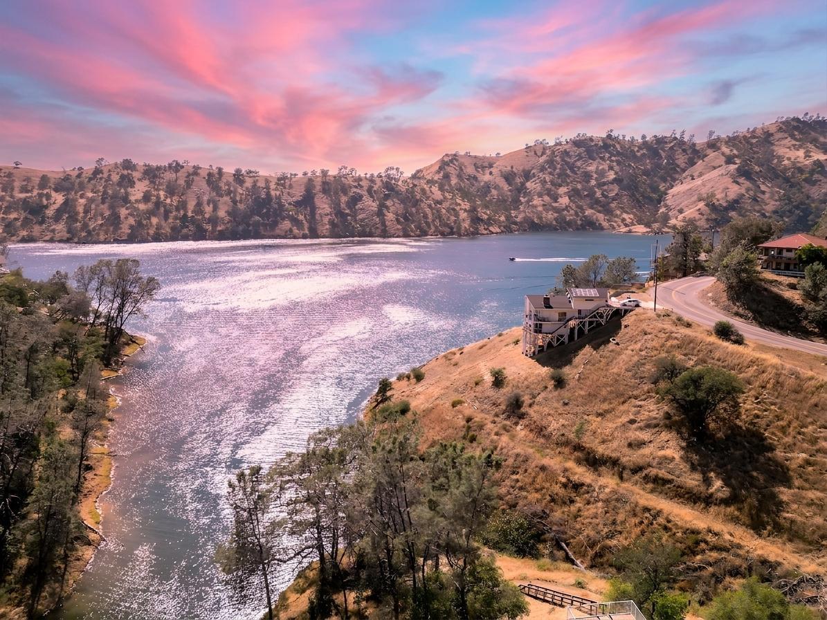 27817 Sky Harbour Road Friant, CA 93626 - Photo 35 of 36 a view of a lake with trees and houses in the back
