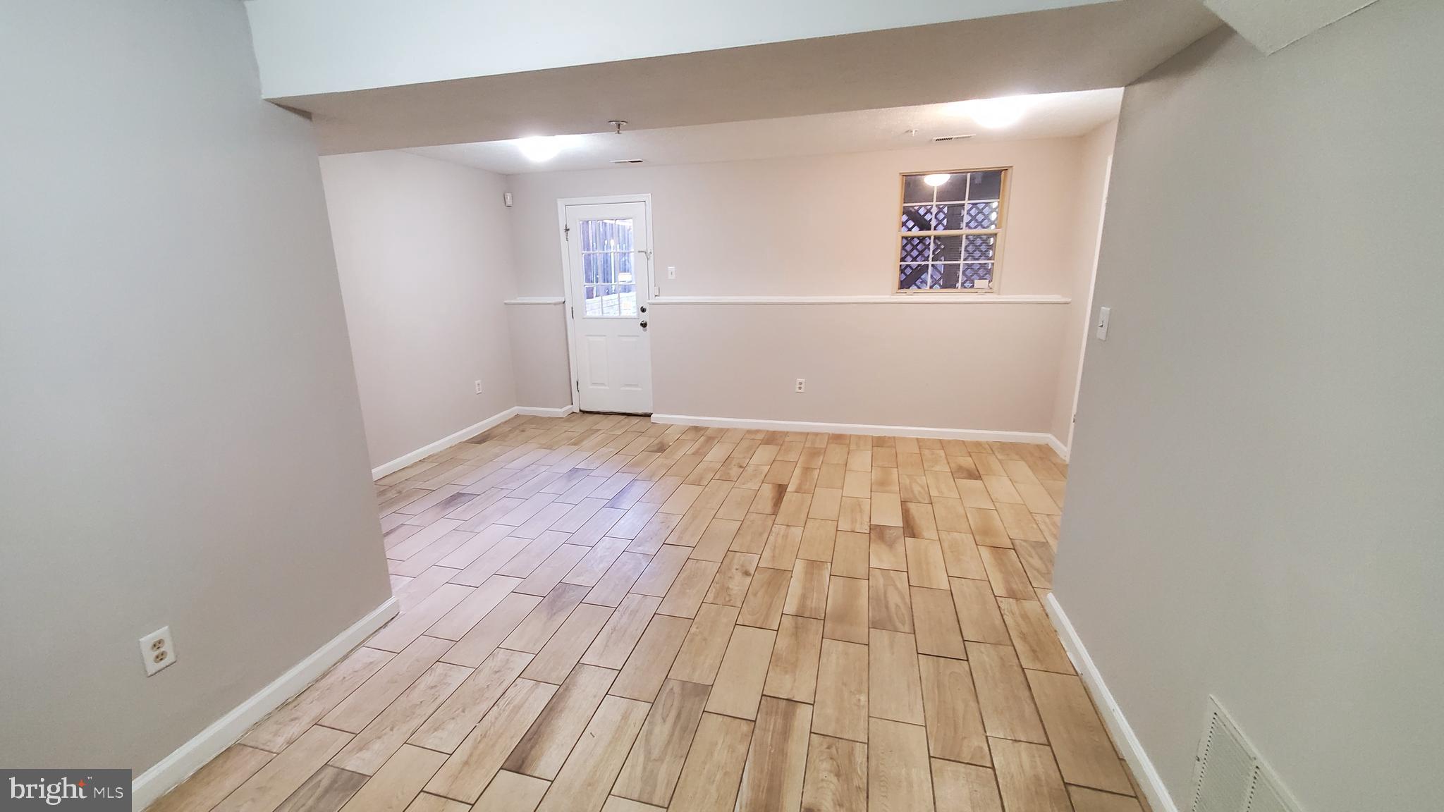 8613 Jacks Reef Road Laurel, MD 20724 - Photo 14 of 17 Tiled Basement Family Room