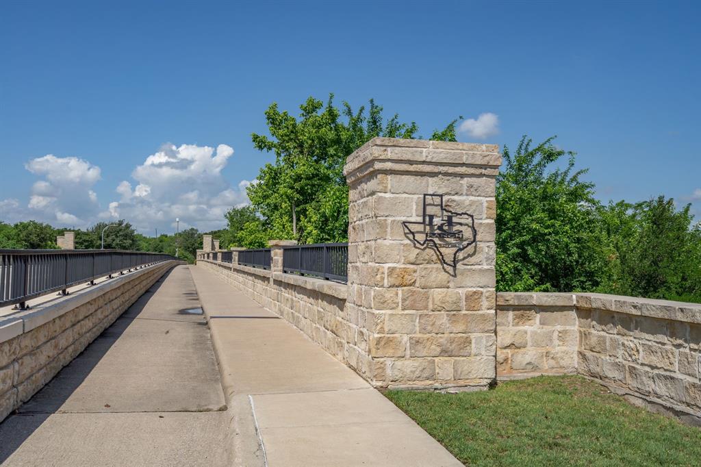 1973 Lariat Drive Fort Worth, TX 76247 - Photo 23 of 28 a view of a terrace with a garden