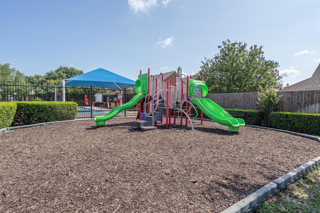 1973 Lariat Drive Fort Worth, TX 76247 - Photo 24 of 28 a view of outdoor space with playground and green space