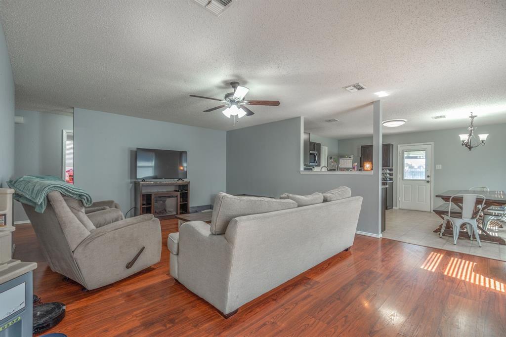 1973 Lariat Drive Fort Worth, TX 76247 - Photo 6 of 28 a living room with furniture and a wooden floor