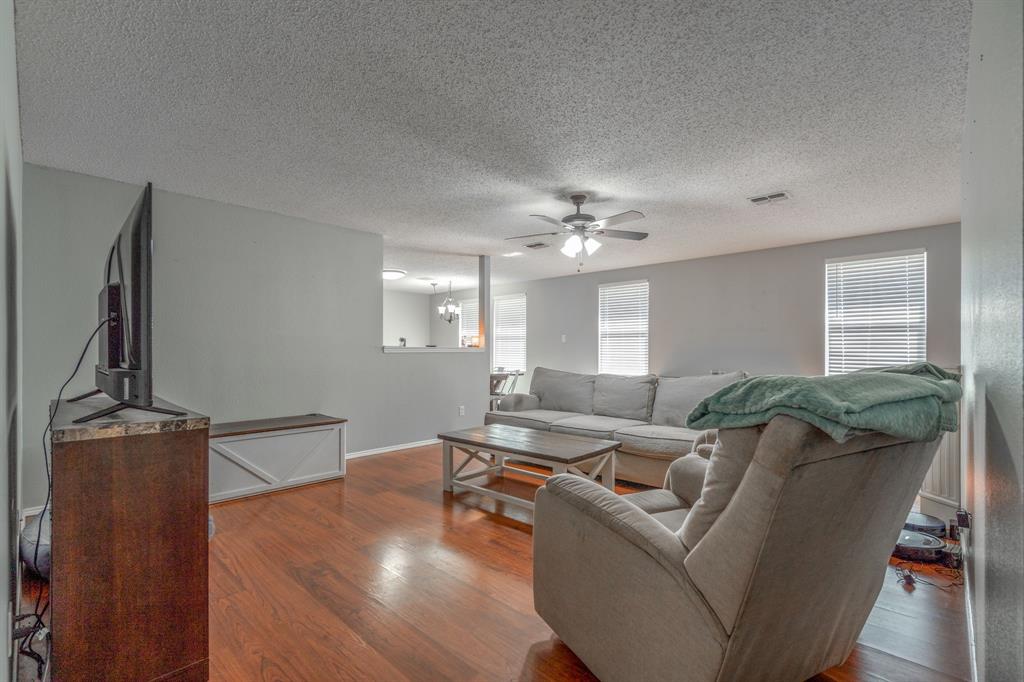 1973 Lariat Drive Fort Worth, TX 76247 - Photo 7 of 28 a living room with furniture and wooden floor