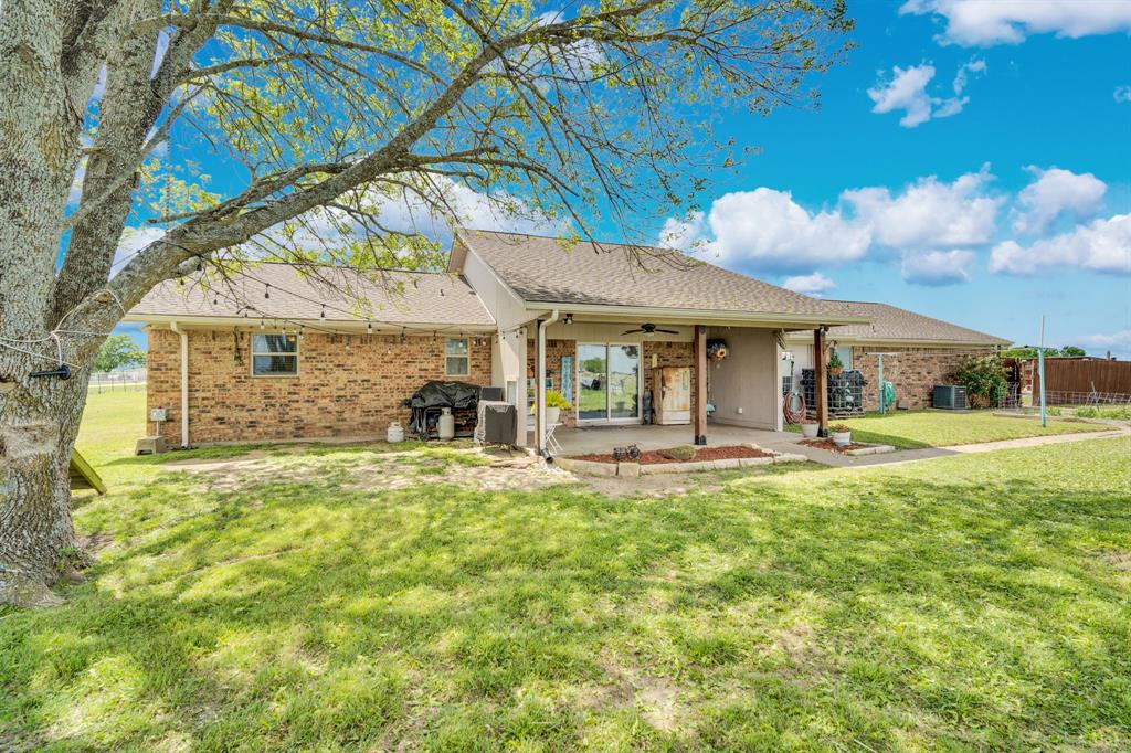 430 Carter Road Italy, TX 76651 - Photo 6 of 36 a front view of a house with swimming pool having outdoor seating