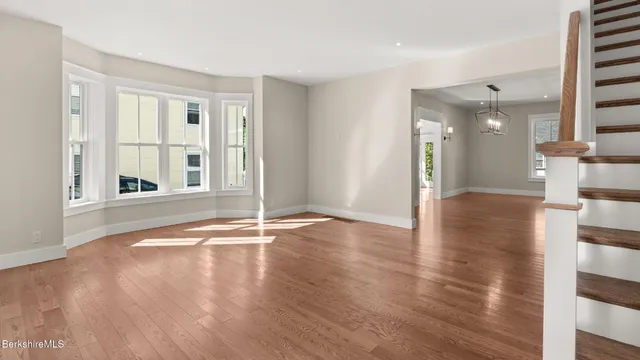 a view of a livingroom with wooden floor