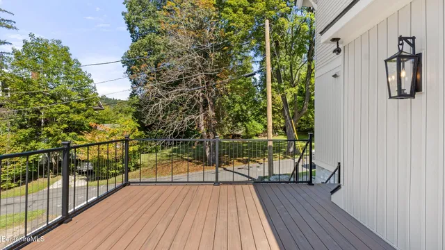 a view of balcony with wooden floor