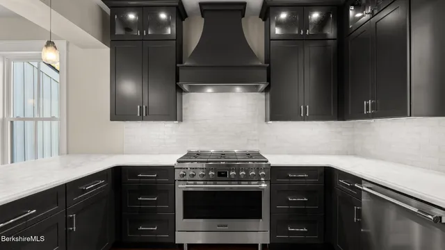 a kitchen with a stove and a microwave