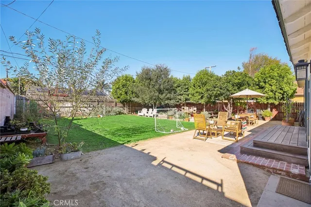 a view of a backyard with sitting area
