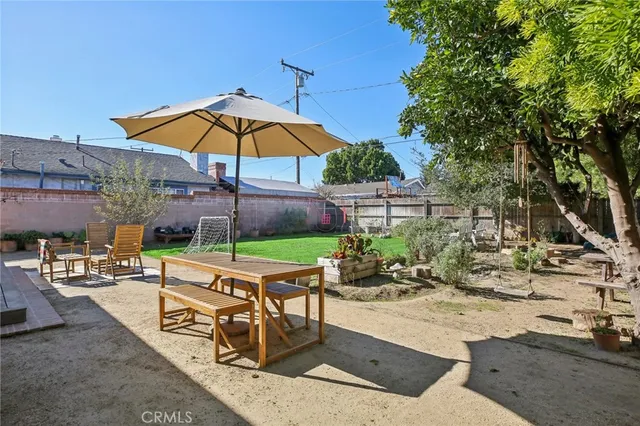 a view of a backyard with sitting area