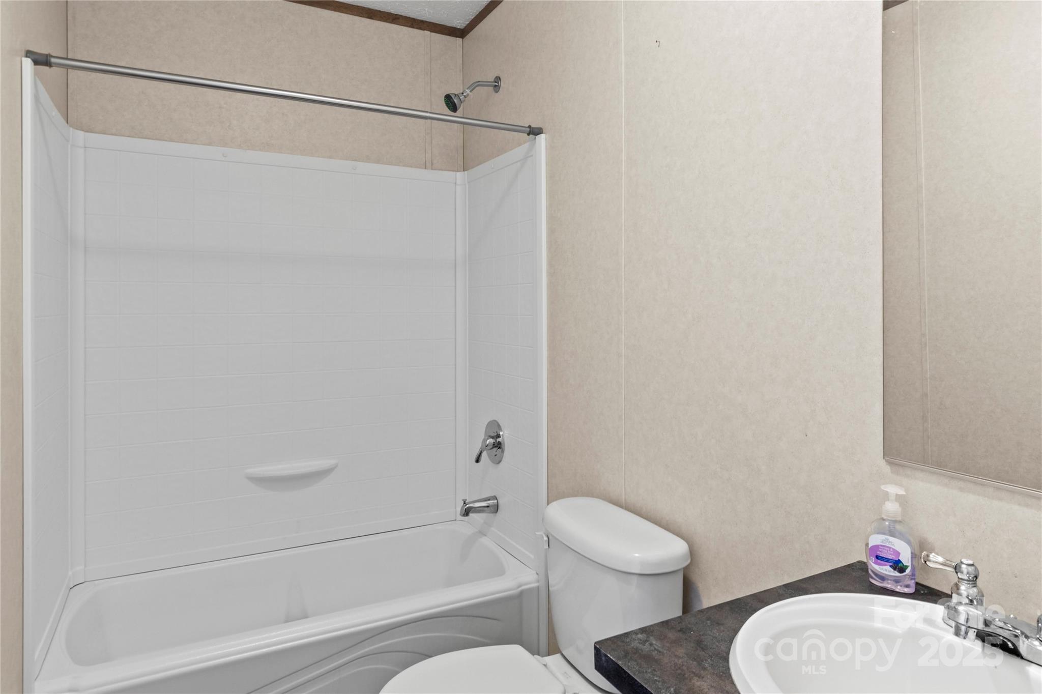 1079 Red Hill Creek Road Dobson, NC 27017 - Photo 21 of 28 a bathroom with a toilet and a shower