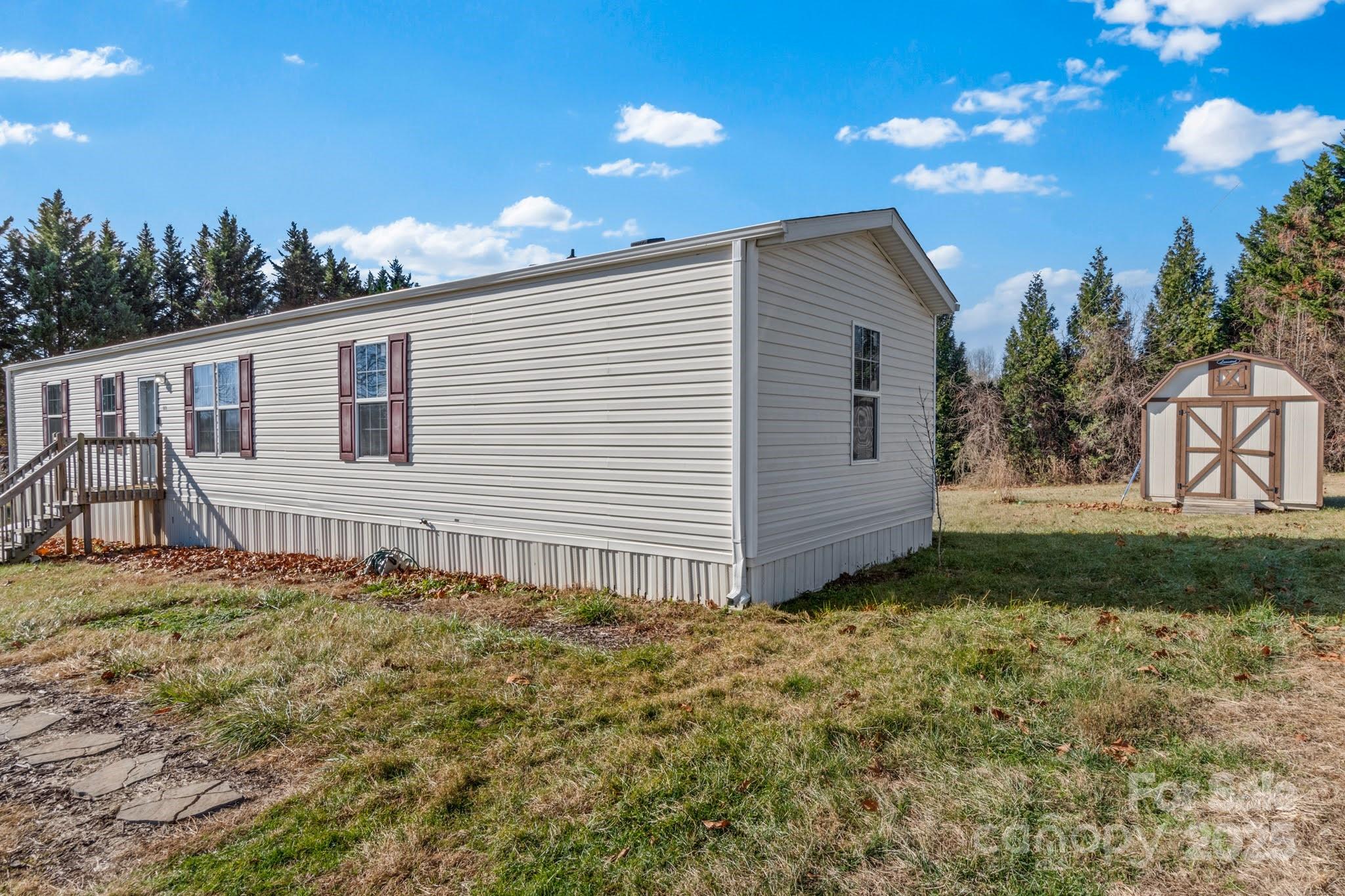 1079 Red Hill Creek Road Dobson, NC 27017 - Photo 5 of 28 a backyard of a house with lots of green space