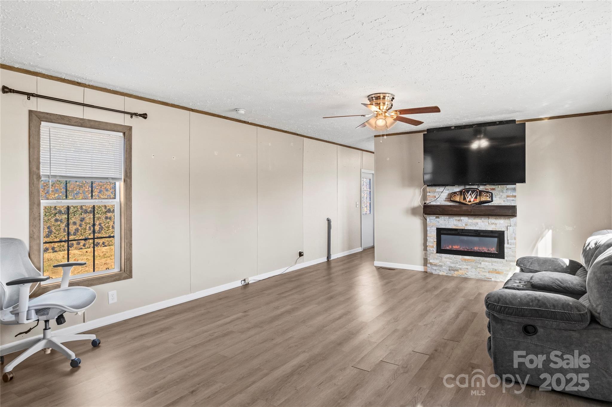 1079 Red Hill Creek Road Dobson, NC 27017 - Photo 7 of 28 a living room with furniture and a flat screen tv
