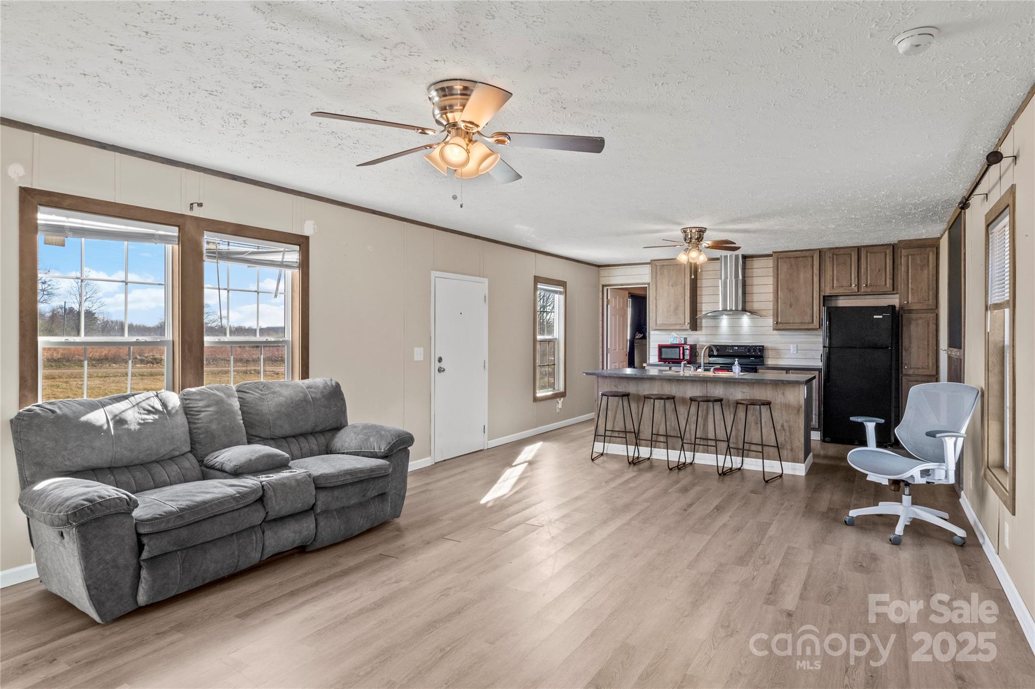 1079 Red Hill Creek Road Dobson, NC 27017 - Photo 8 of 28 a living room with furniture and a flat screen tv
