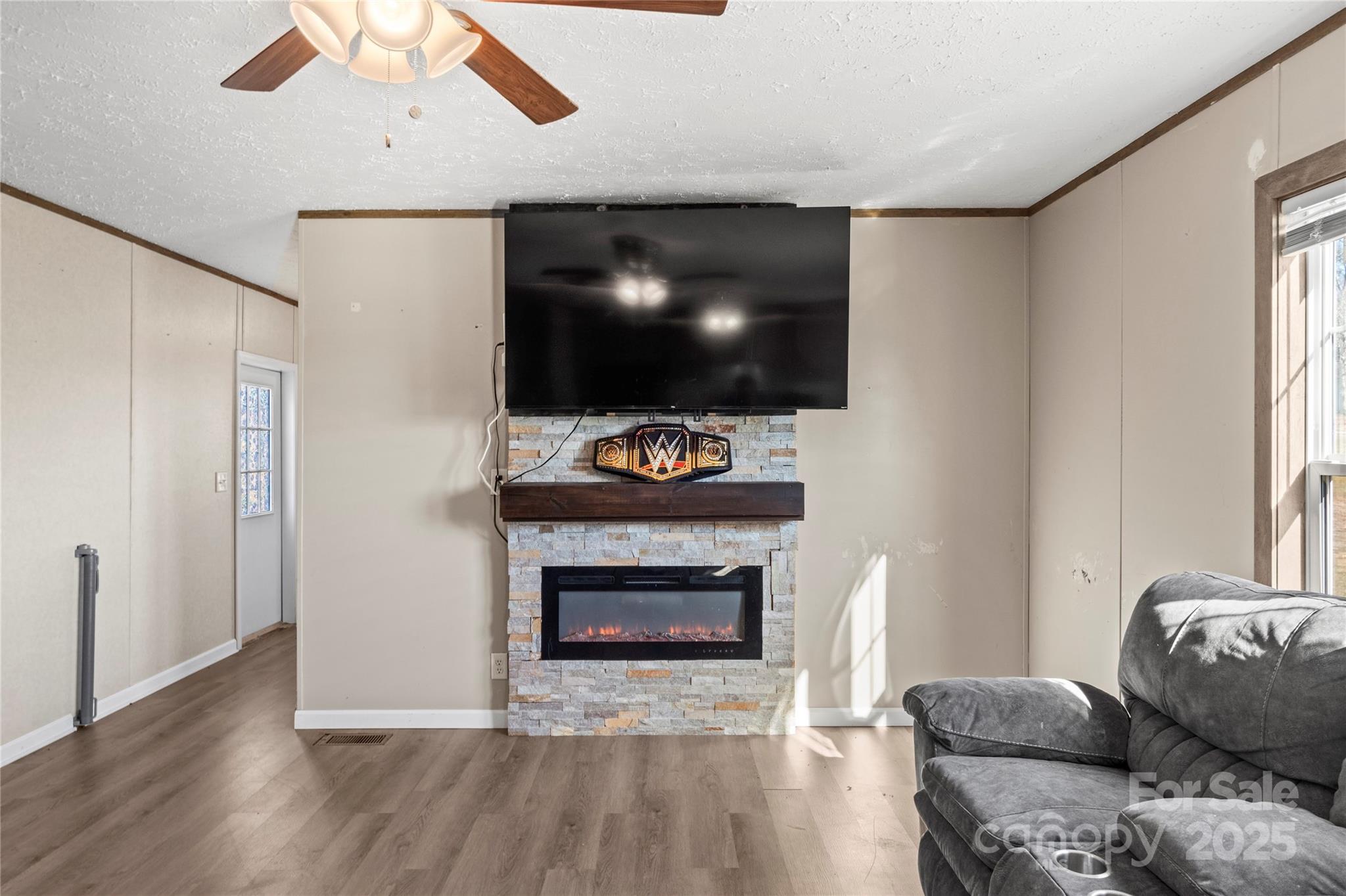 1079 Red Hill Creek Road Dobson, NC 27017 - Photo 9 of 28 a living room with furniture and a flat screen tv