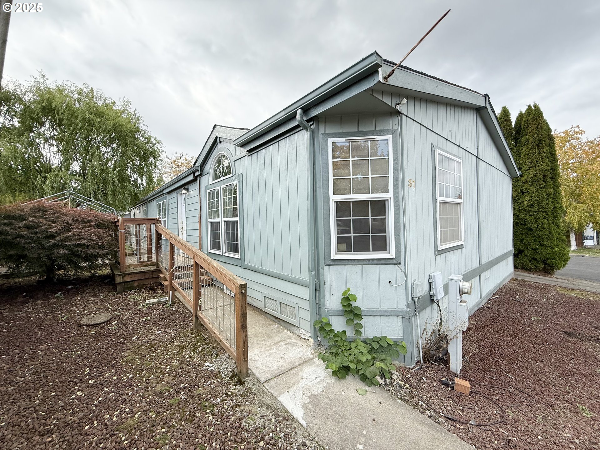 1282 3rd Street, Unit 37 Lafayette, OR 97127 - Photo 1 of 28 a house with trees in the background