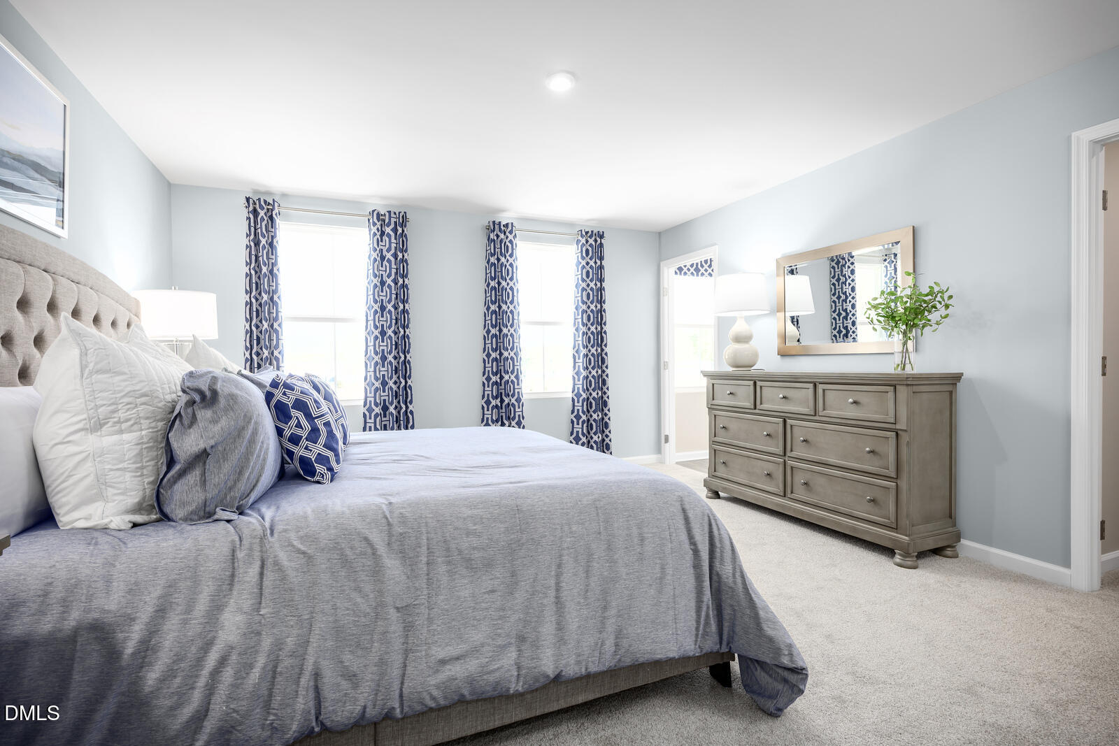 217 Jasmine Street Wendell, NC 27591 - Photo 12 of 26 a bedroom with a bed and a dresser