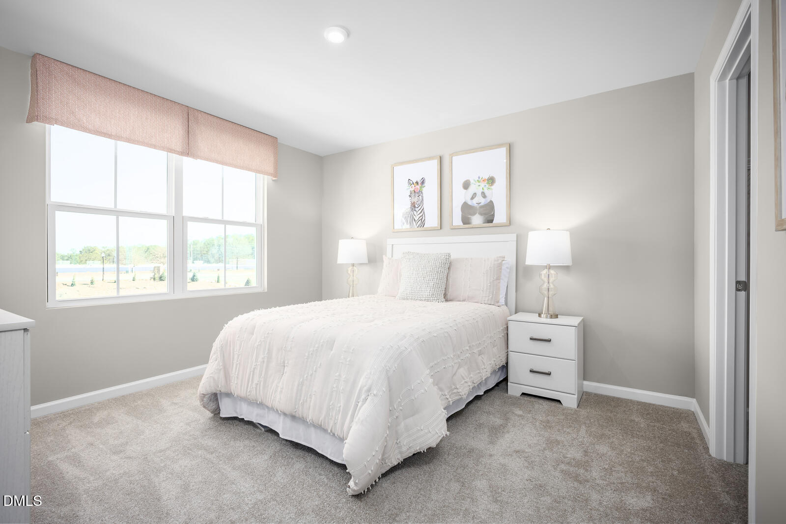 217 Jasmine Street Wendell, NC 27591 - Photo 16 of 26 a bedroom with a bed and a window