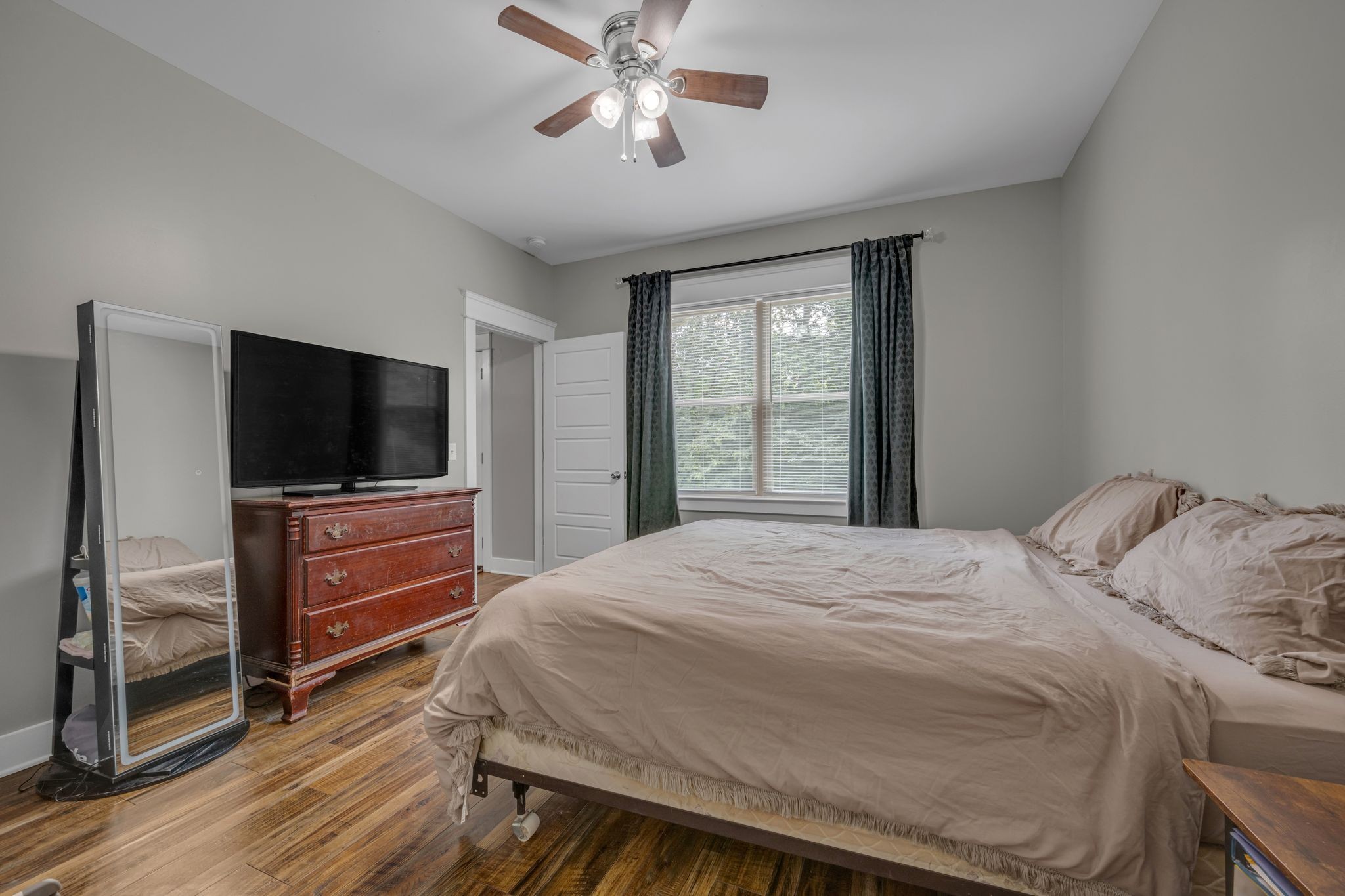1116 Taylortown Road White Bluff, TN 37187 - Photo 15 of 29 a bedroom with a bed and a flat screen tv