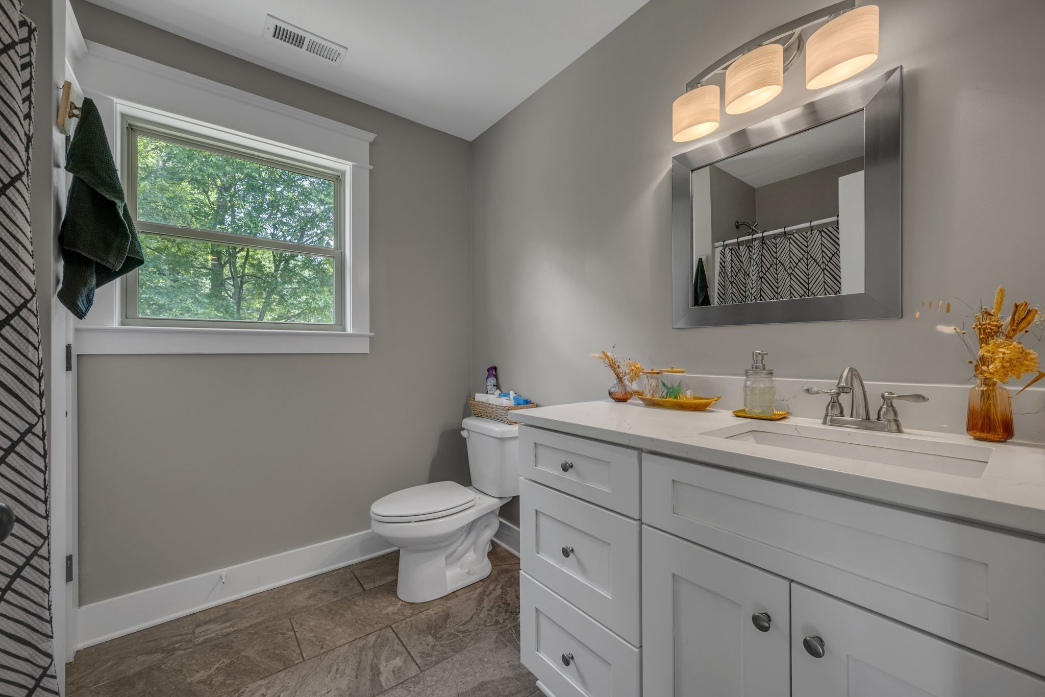 1116 Taylortown Road White Bluff, TN 37187 - Photo 22 of 29 a bathroom with a toilet sink and mirror