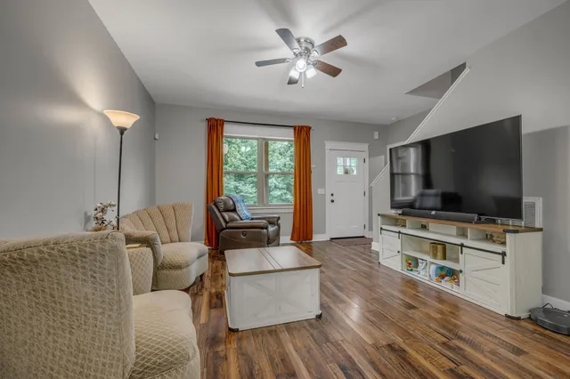 a living room with furniture and a flat screen tv