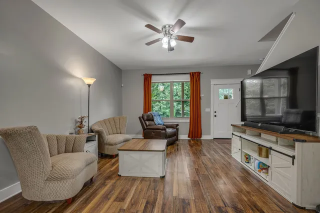 a living room with furniture and a flat screen tv