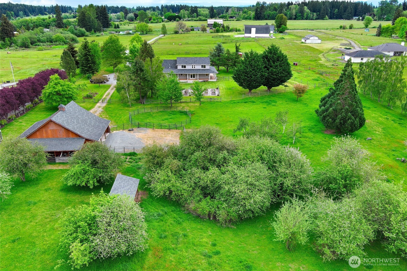 14419 Martinson Road Southeast Yelm, WA 98597 - Photo 27 of 39 a view of a garden with a building in front of it