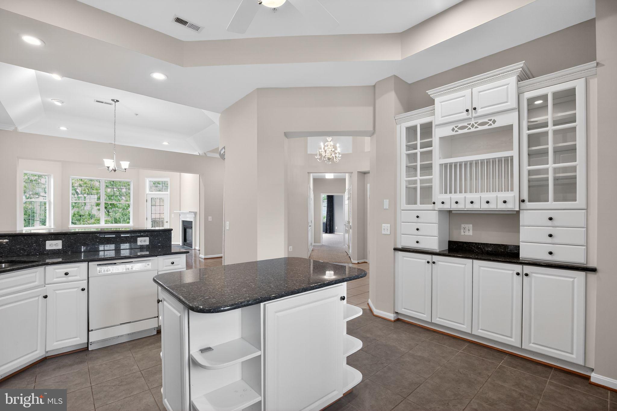 733 Runabout Loop, Unit 733 Solomons, MD 20688 - Photo 13 of 50 Kitchen with island and china cabinet