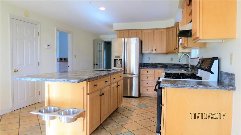 191 Edes Falls Road Naples, ME 04055 - Photo 4 of 33 Kitchen. Open door leads to a first...