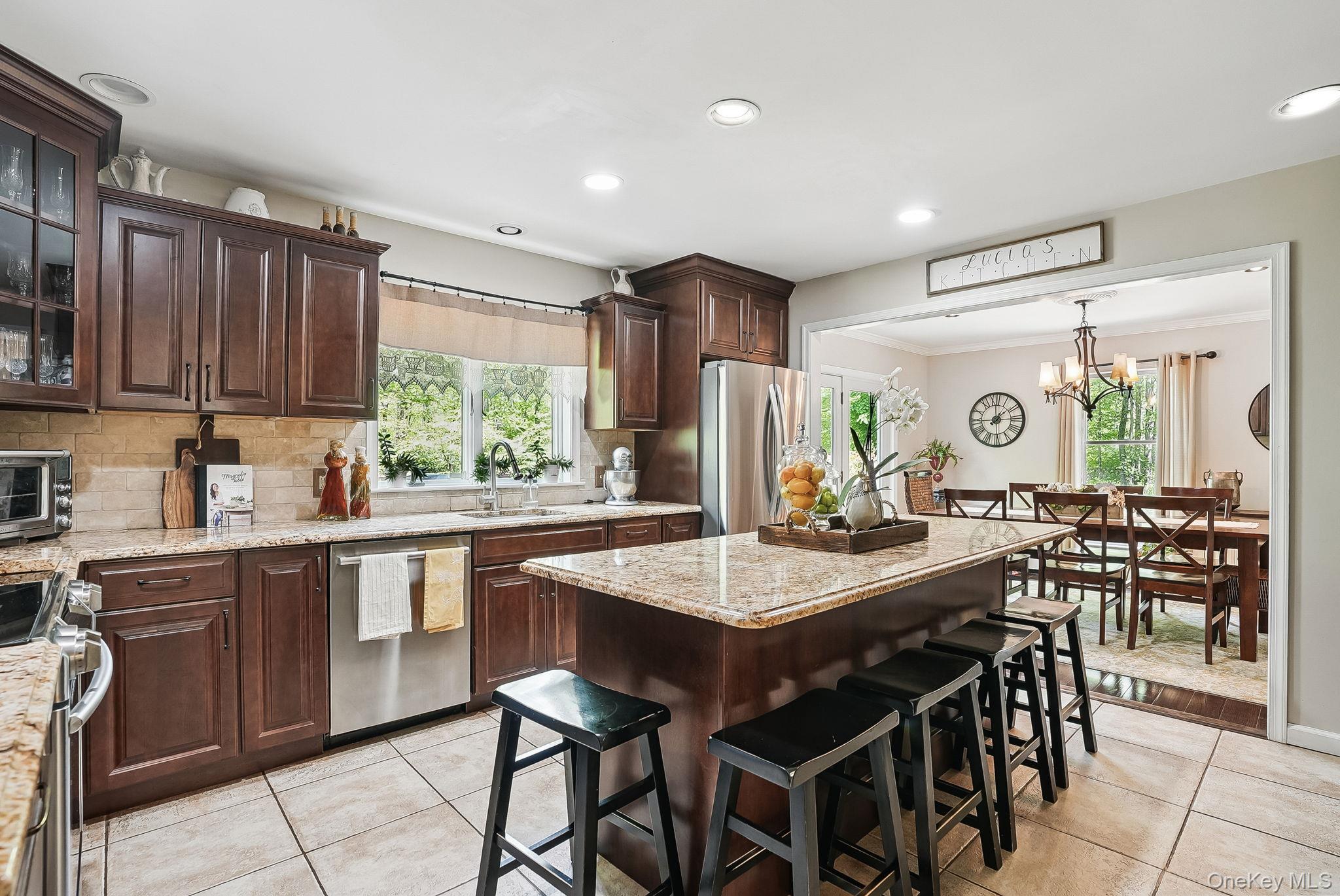 304 Church Road Putnam Valley, NY 10579 - Photo 7 of 50 Kitchen featuring stainless steel appliances, a sink, light tile patterned flooring, tasteful backsplash, and recessed lighting
