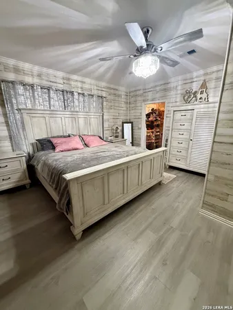 a bed room with a bed and a television