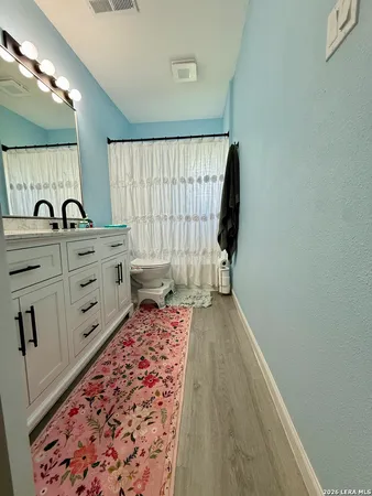a bed room with a bed and a window