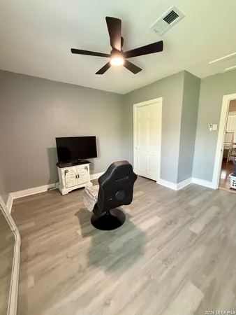 a bed room with a bed and a television