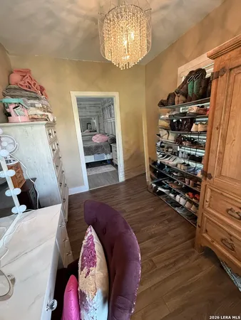 a bedroom with a bed and a mirror