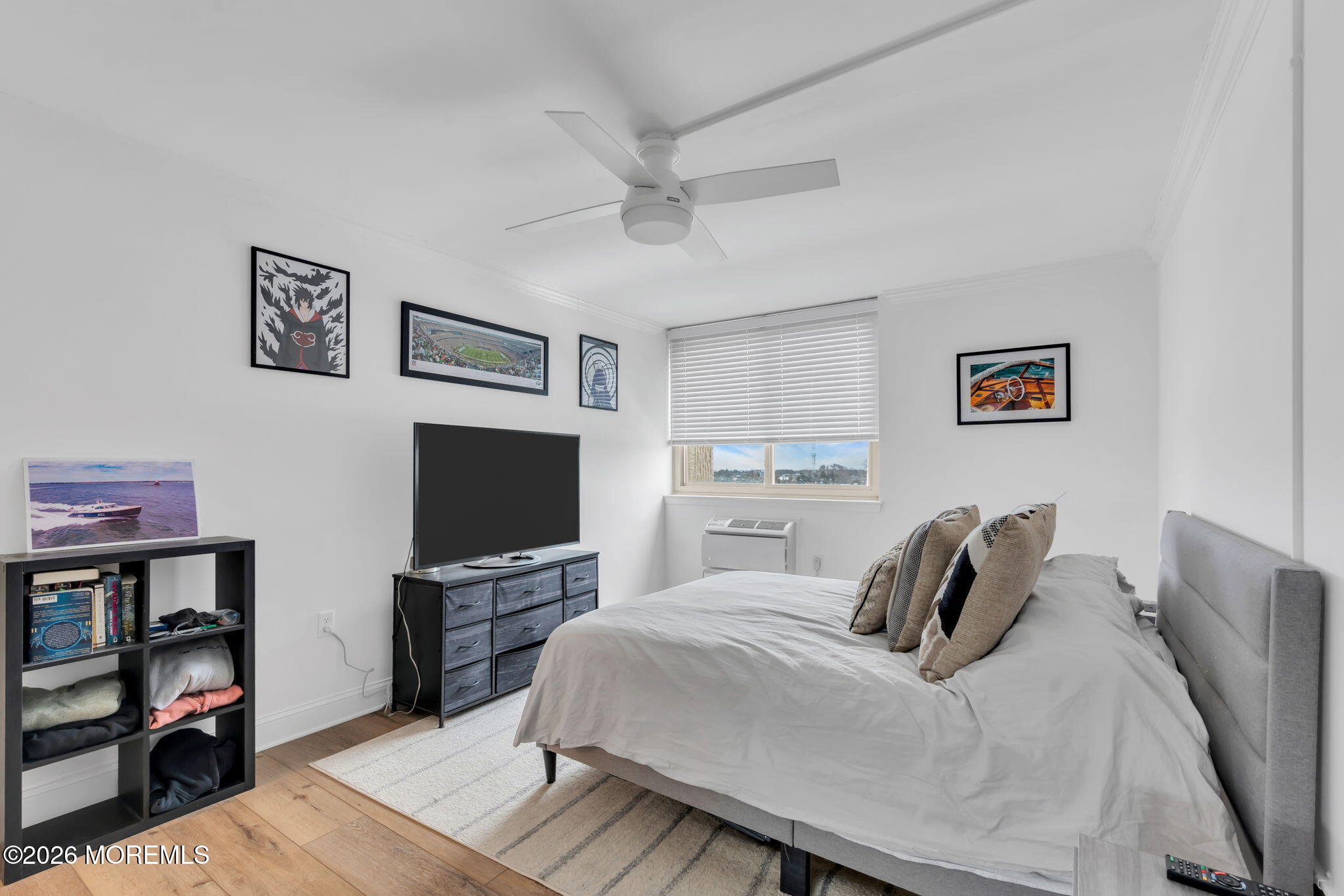 1000 River Road, Unit 7G Belmar, NJ 07719 - Photo 14 of 25 a bedroom with a bed and a television