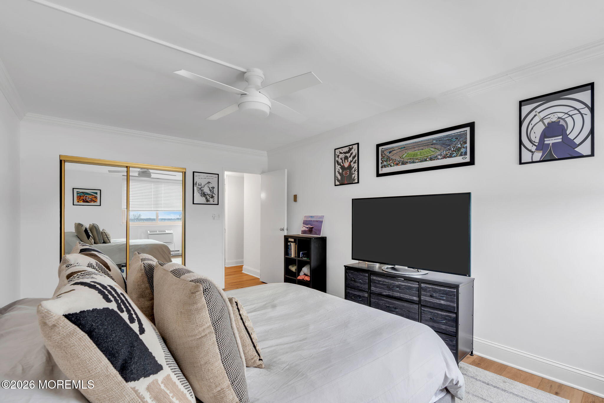 1000 River Road, Unit 7G Belmar, NJ 07719 - Photo 15 of 25 a bedroom with a bed and a flat screen tv