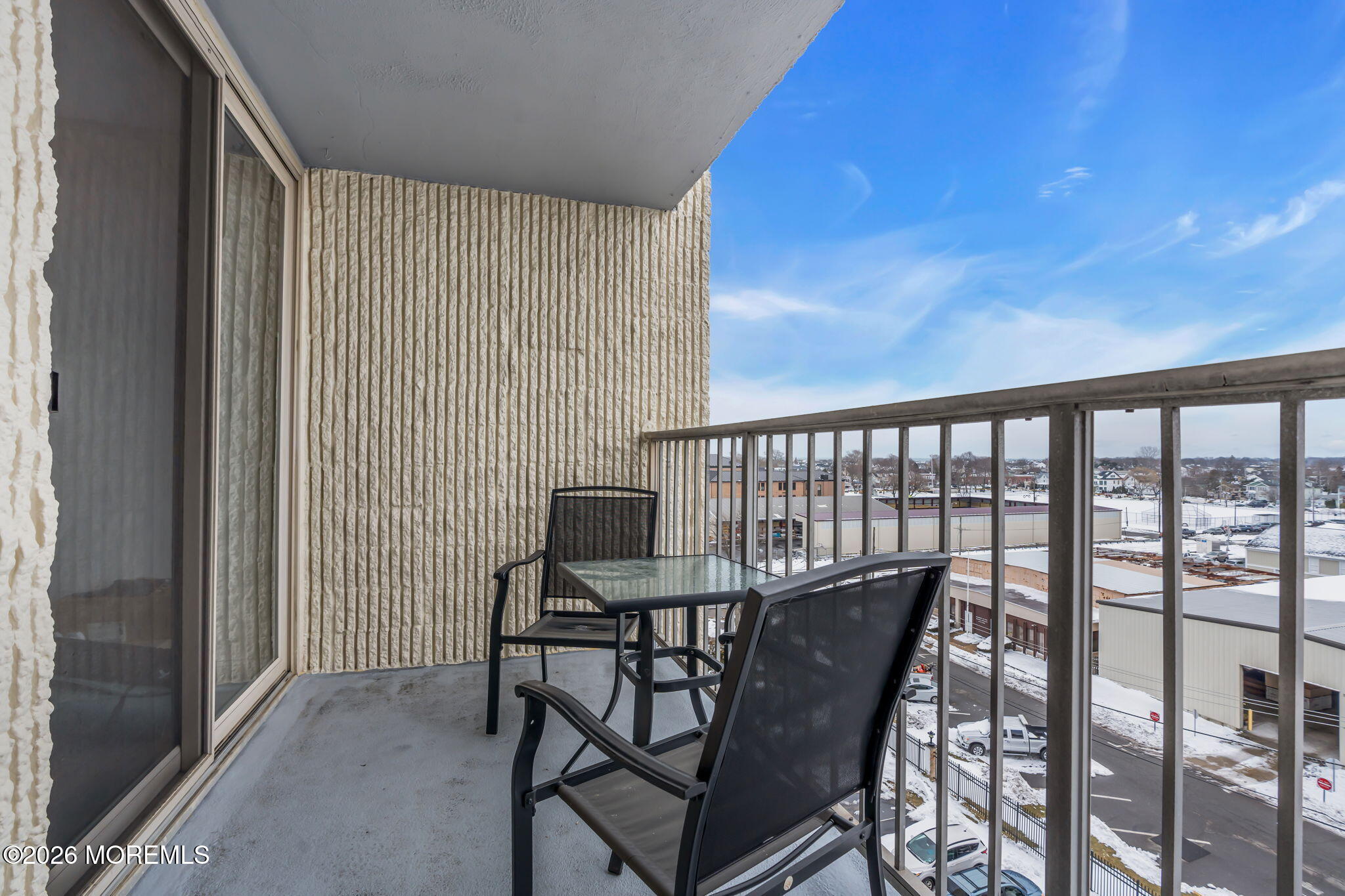 1000 River Road, Unit 7G Belmar, NJ 07719 - Photo 17 of 25 a view of a chairs and table in the balcony