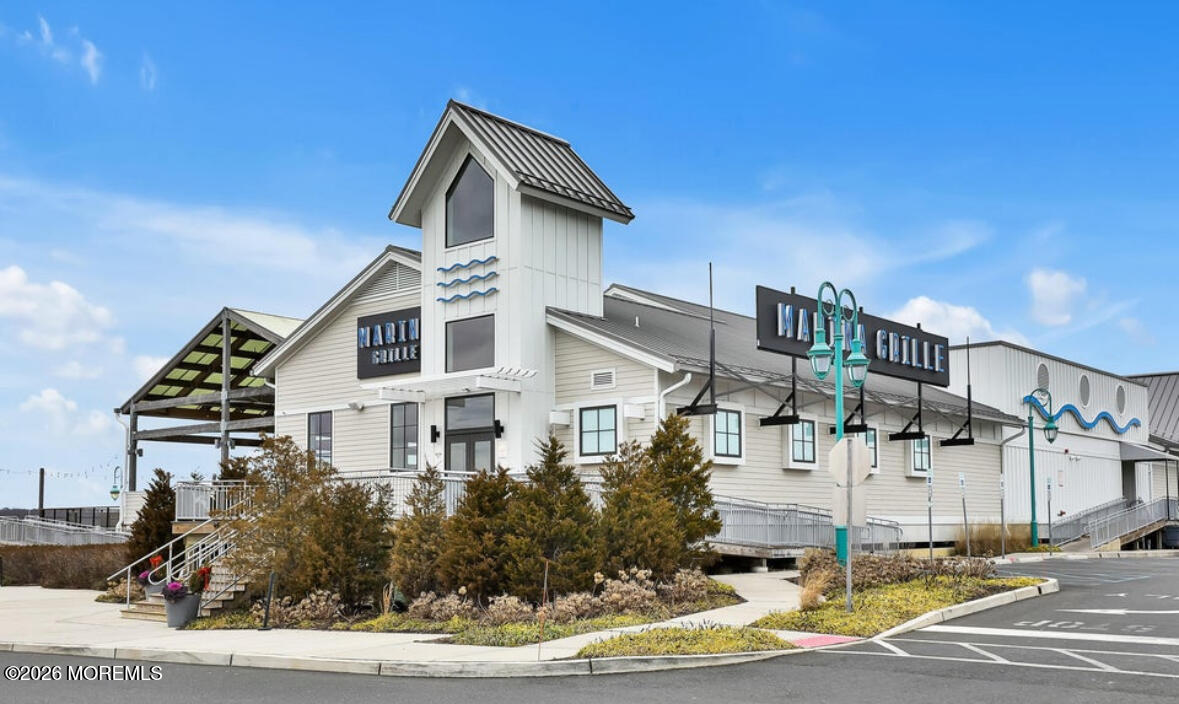 1000 River Road, Unit 7G Belmar, NJ 07719 - Photo 25 of 25 a front view of a house with a yard