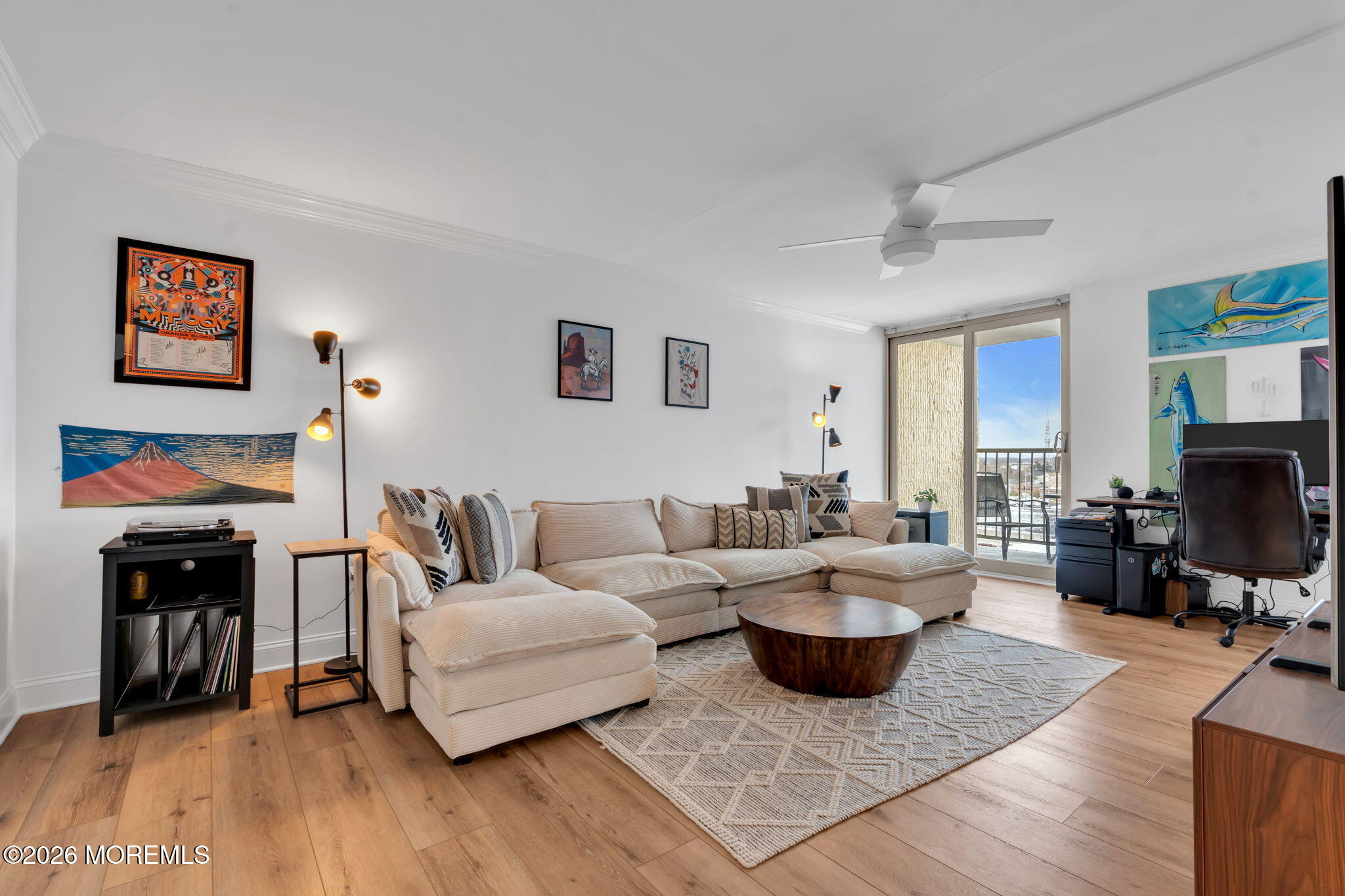 1000 River Road, Unit 7G Belmar, NJ 07719 - Photo 3 of 25 a living room with furniture and a flat screen tv